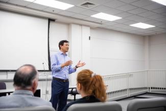Man speaking in front of classroom